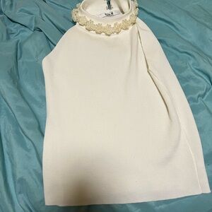 Halterneck top with faux pearl